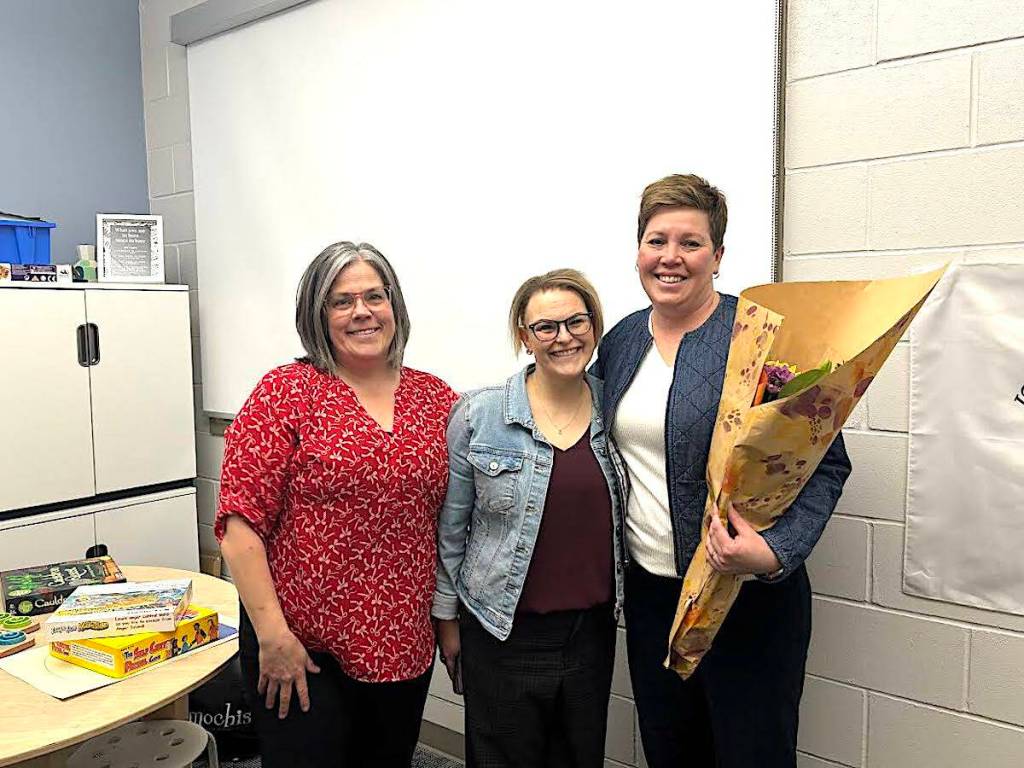 Holy Trinity Catholic School principal Jayme Locke and assistant principal Tammy Chrusch congratulate Monica Andrew, nominee for the CCSSA Excellence in Catholic Education Award. (Photo contributed by Red Deer Catholic Regional Schools)